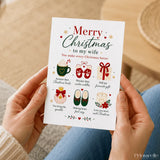A white christmas card for wife with six gold accented illustrations including mug mittens gift perfume slippers and candle
